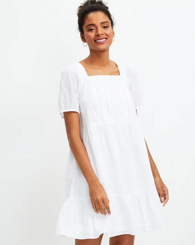 white flowy dress with square neckline and sleeves