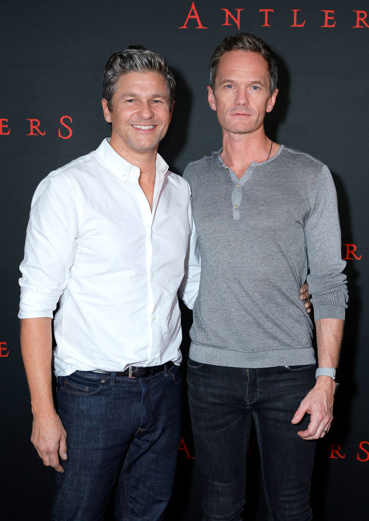 Burtka and Harris with their arms around each other