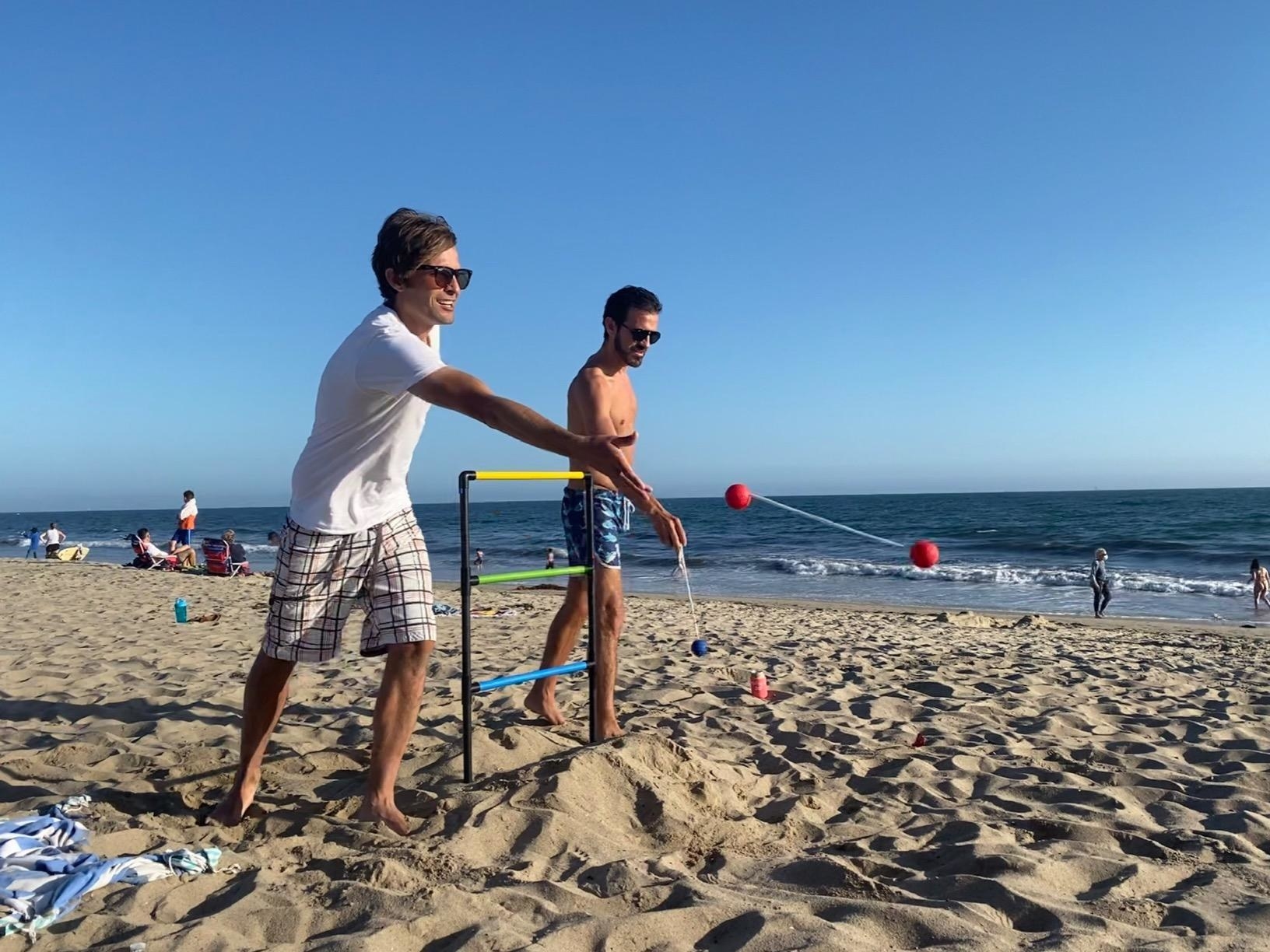 reviewer&#x27;s image of people playing ladder game at the beach