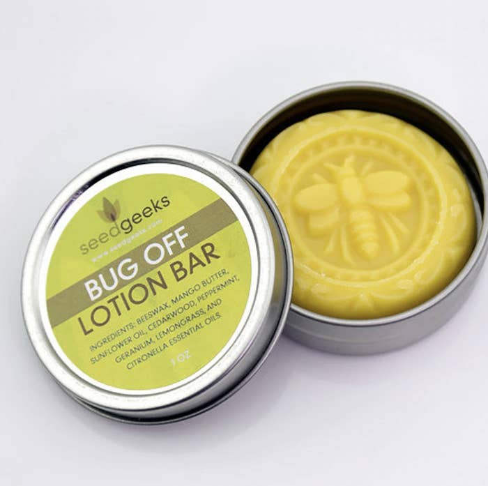 The bug off lotion bar in open tin