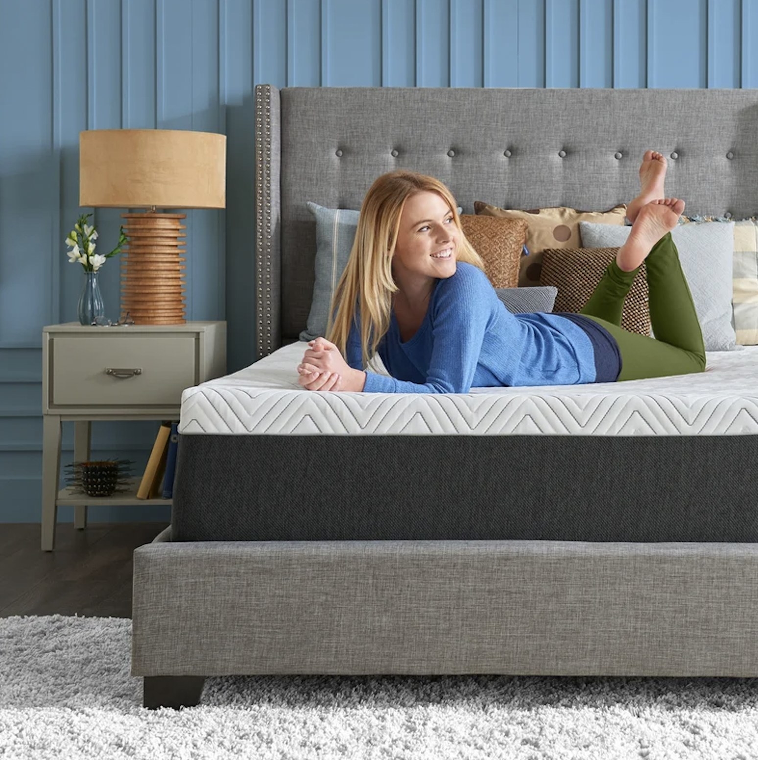 Model laying on their stomach on the mattress