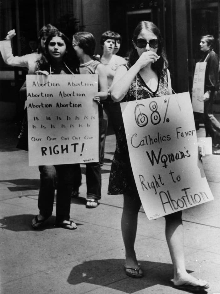 Protesters&#x27; signs read &quot;abortion is our right&quot; and &quot;68% of Catholics favor woman&#x27;s right to abortion&quot; 