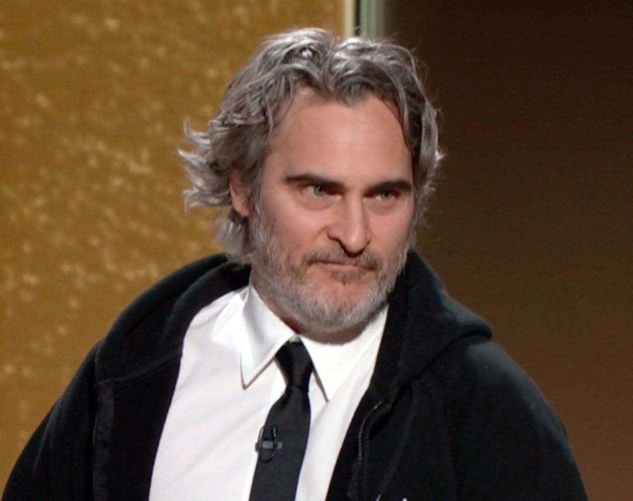 Joaquin Phoenix speaks onstage at the 78th Annual Golden Globe Awards