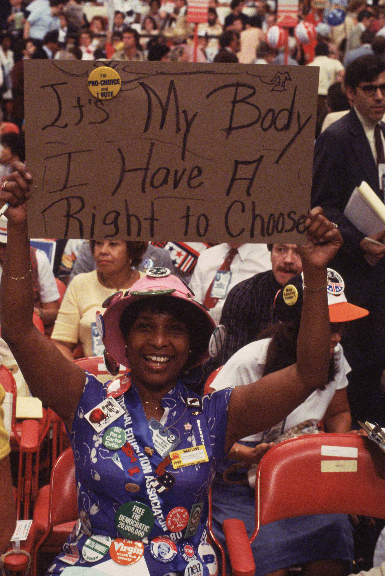 A woman holding up a sign reading &quot;It&#x27;s My Body And I Have A Right To Choose&quot;