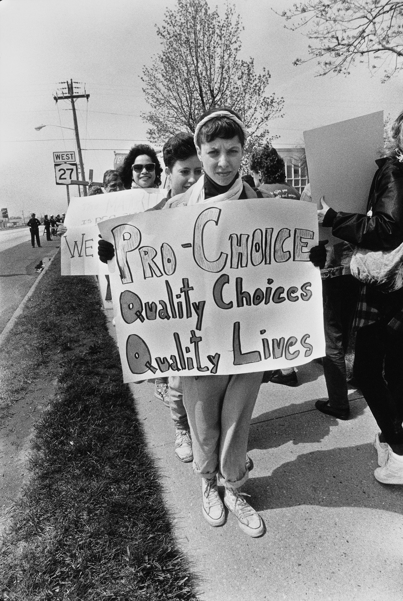 A demonstrator&#x27;s sign reads &quot;pro-choice, quality choices, quality lives&quot;