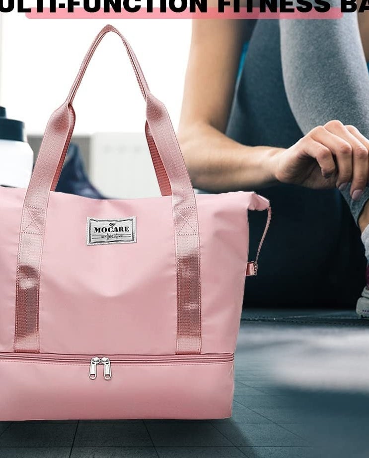 The bag on the floor of a gym next to a person