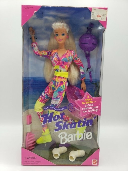 An old Barbie in a box that is wearing an outfit very similar to Margot