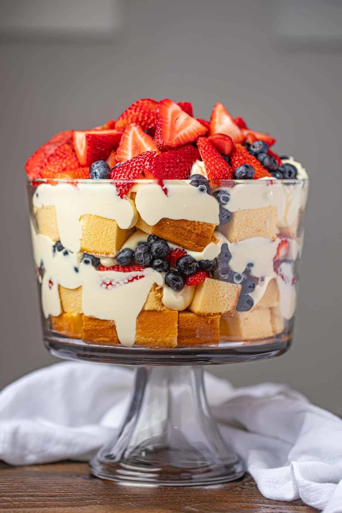 A mixed berry trifle in a glass bowl.