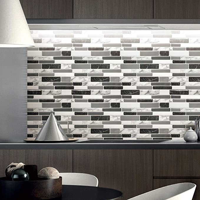 The tile backsplash on a wall in a trendy kitchen