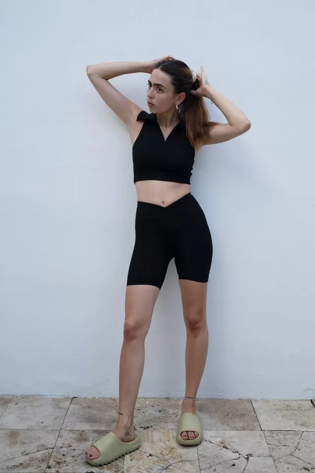 Model wearing black v shorts