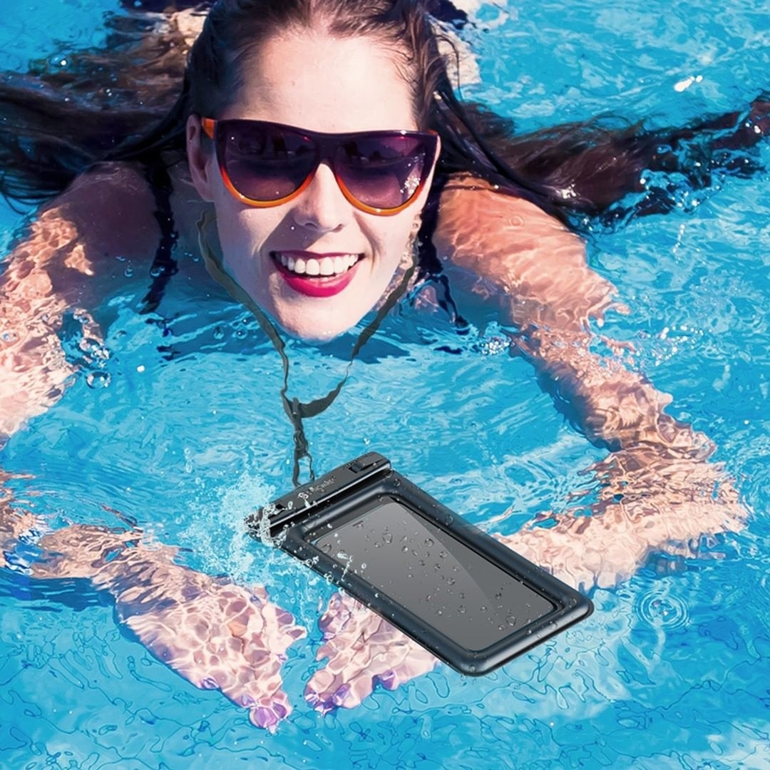 a person swimming while wearing the phone pouch around their neck