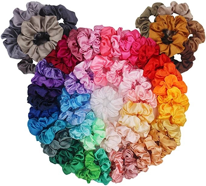 a pile of scrunchies in a rainbow of colours
