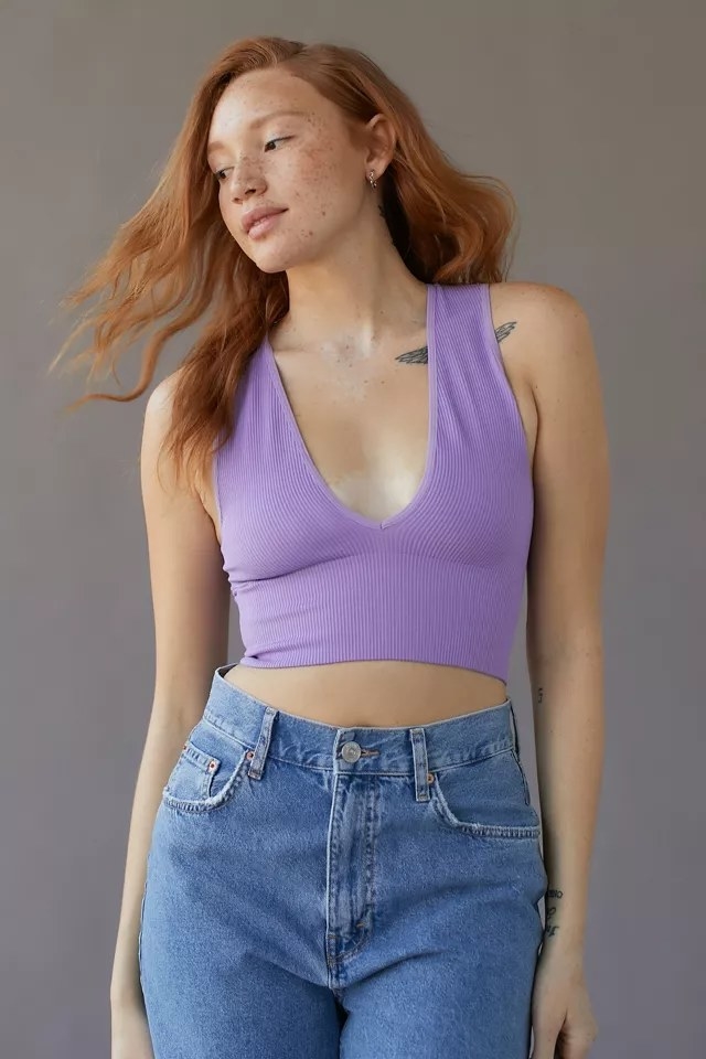 Model wearing lavender top with jean pants