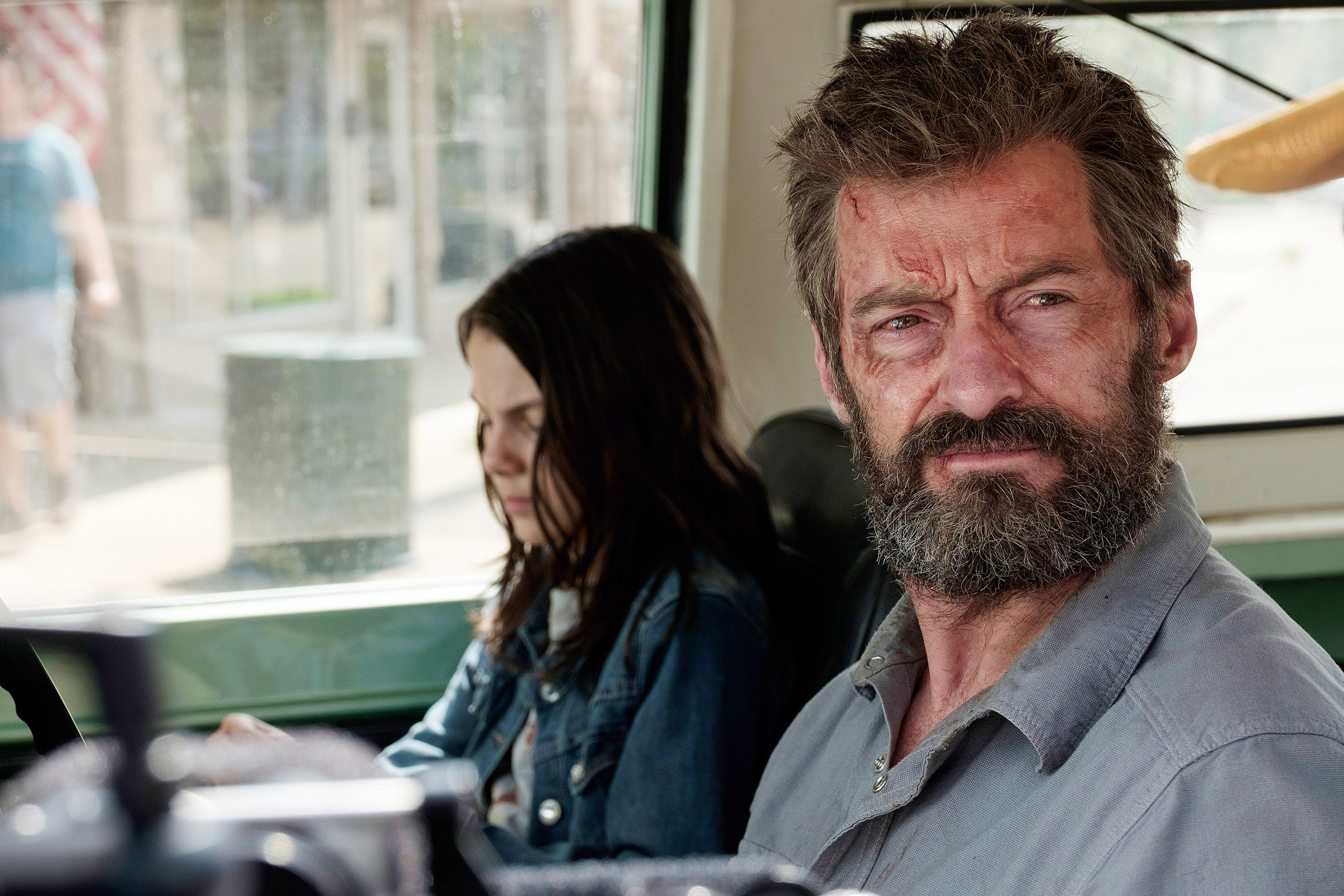 Laura and Wolverine sitting together in Logan movie