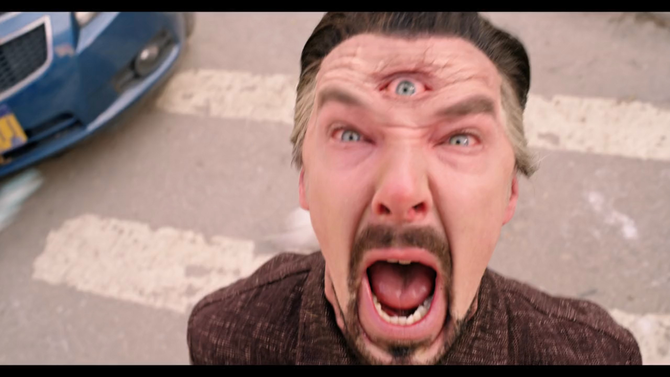 close up of doctor strange shouting outside with the third eye open