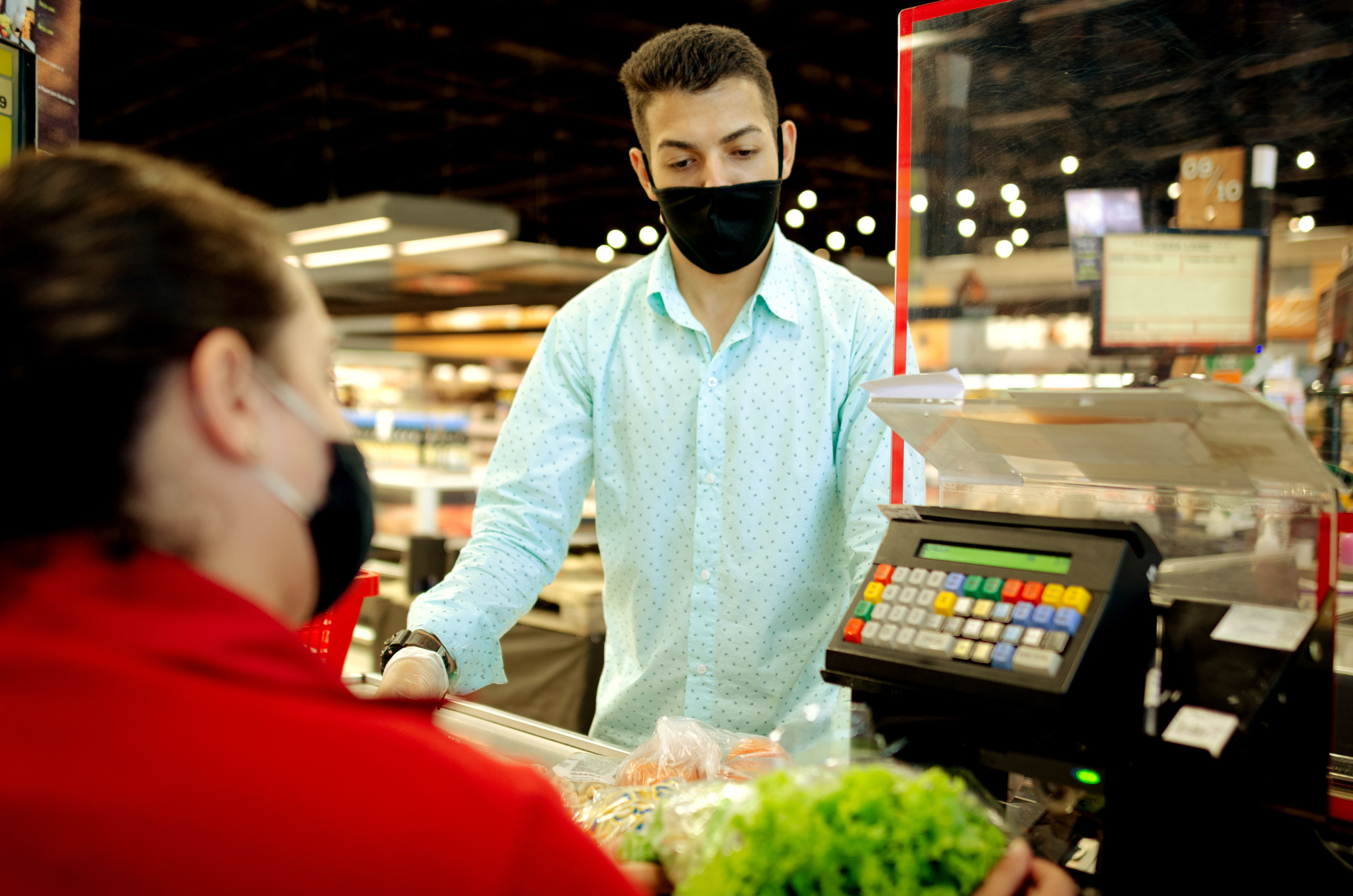 cashier ringing up a man