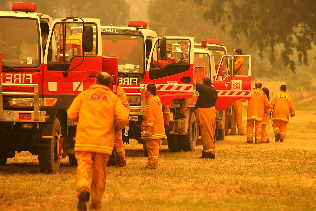Volunteer firefighters work to contain a bushfire near Licola, Victoria