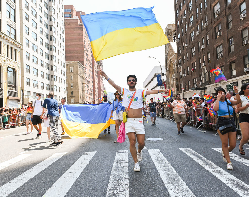 holding ukraine flag during nyc pride