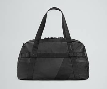 side view of a black duffle bag