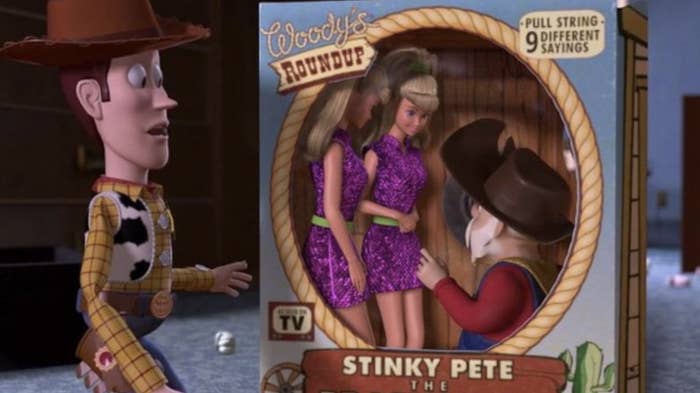 stinky pete in a toy box with two barbies