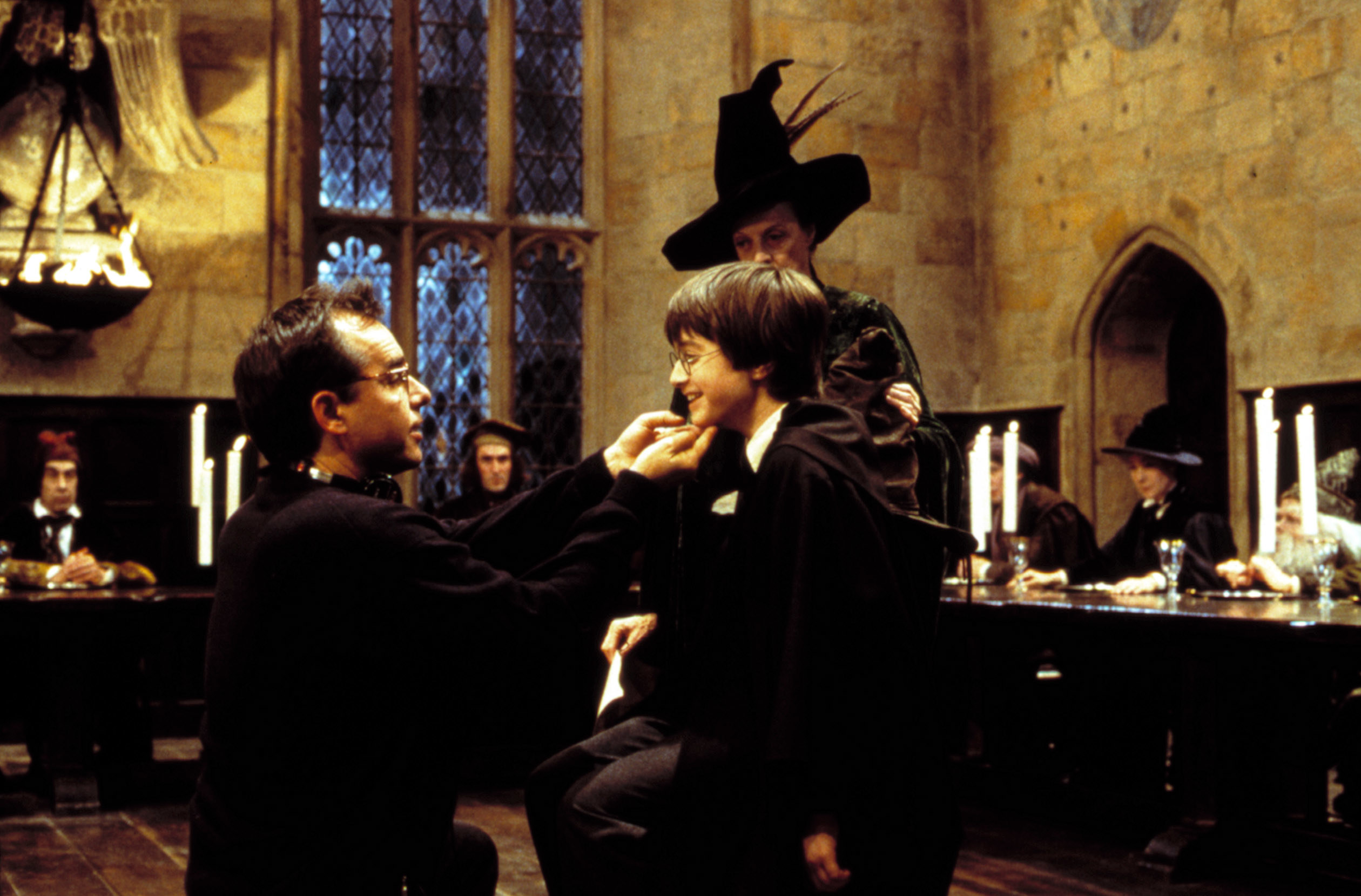 Director Chris Columbus, Daniel Radcliffe, and Maggie Smith on set