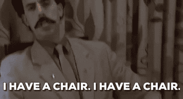 Gif of Sacha Baron Cohen in "Borat" saying "I have a chair. I have a chair."“class=