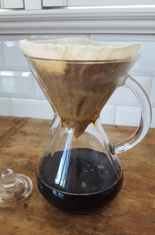 A reviewer using hemp filter in drip coffee machine