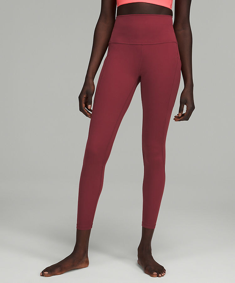 model wearing berry high-rise workout leggings with pockets