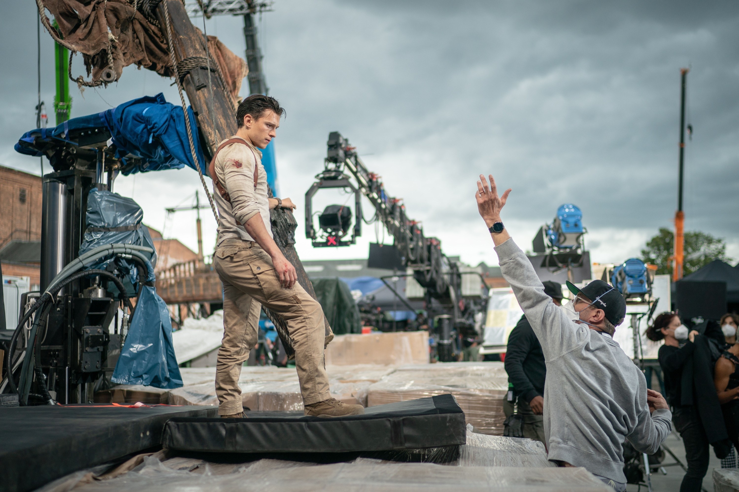 Tom Holland standing up on a mat preparing for a stunt