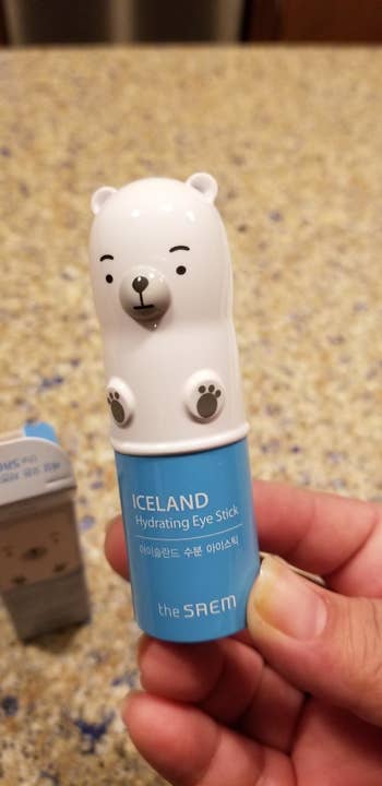 Reviewer holding The Saem Iceland Hydrating Eye Stick