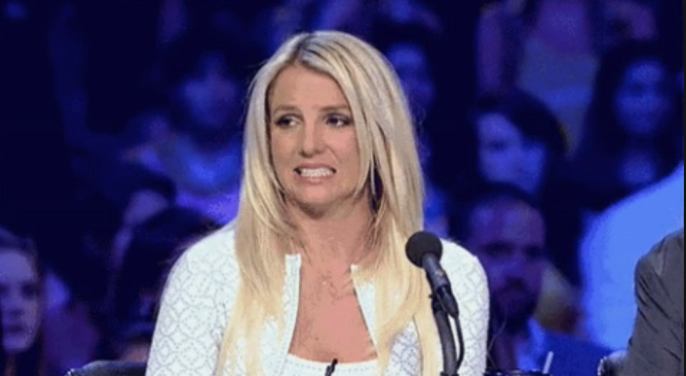 Britney Spears cringing on a show