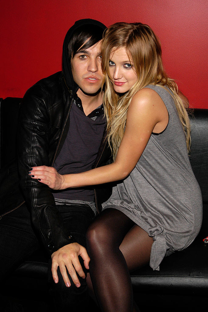 ashley hugging pete as they sit on a couch