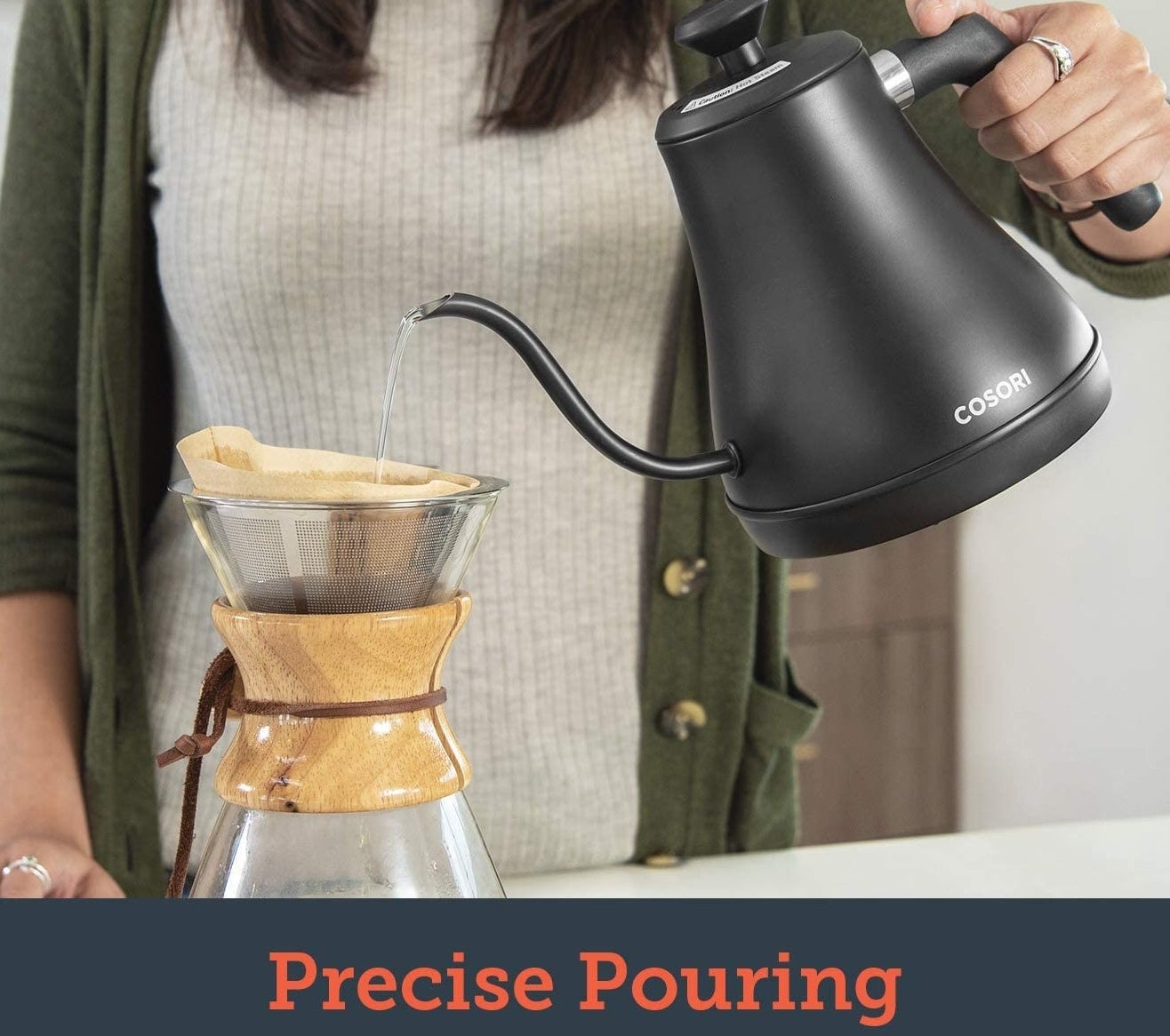 someone using the gooseneck kettle to make pour-over coffee
