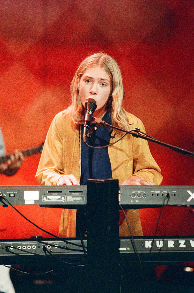 close up of Taylor playing the keyboard on stage