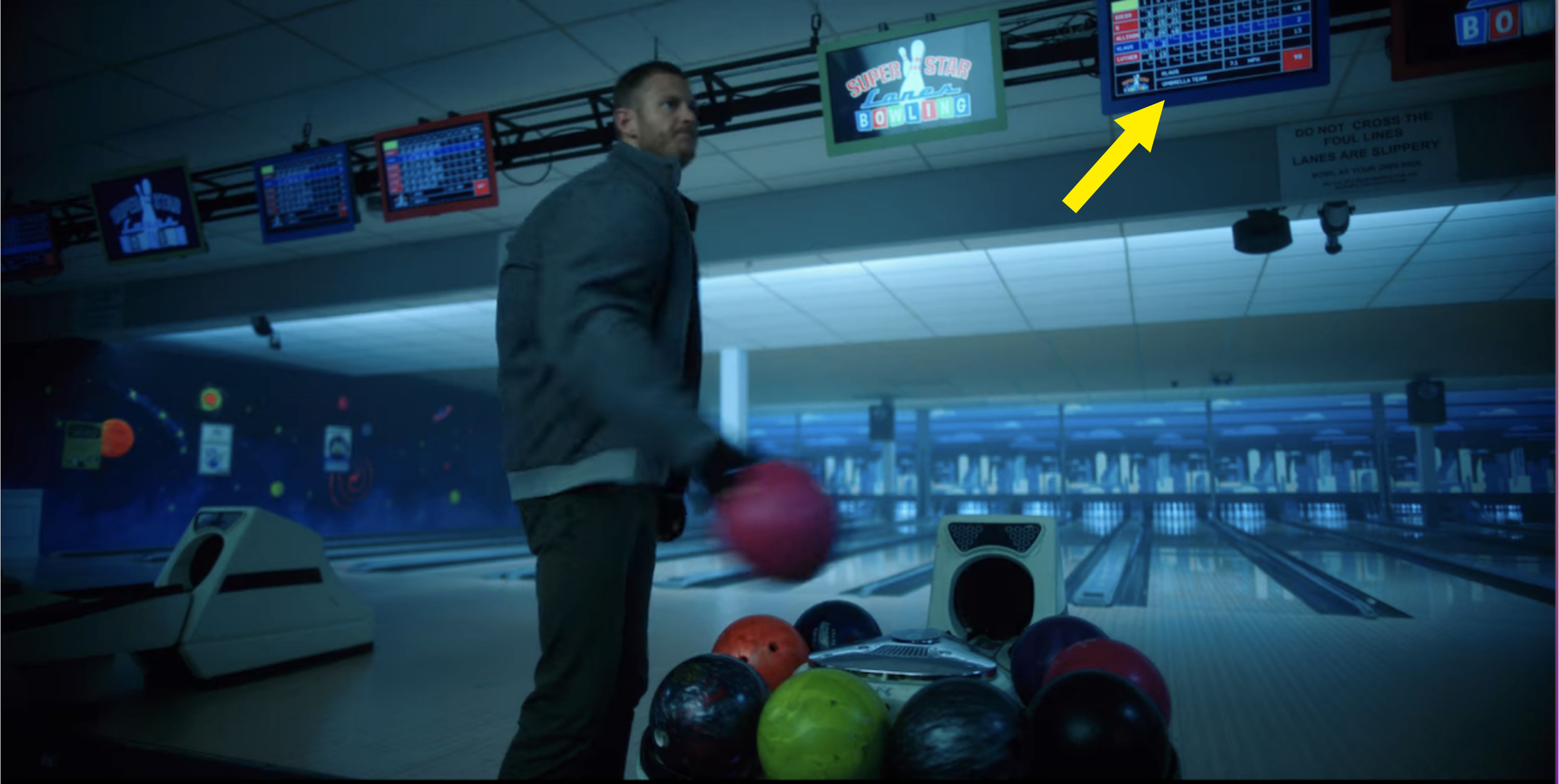 a person bowling and an arrow pointing to the TV with the scores on it