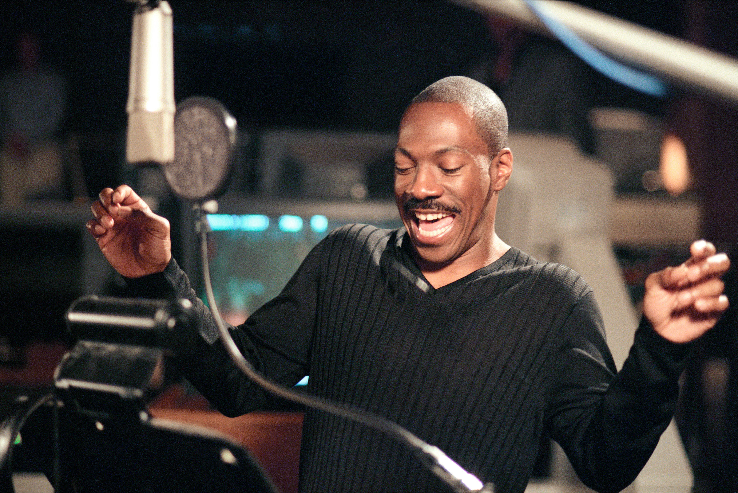 Eddie Murphy in a recording booth