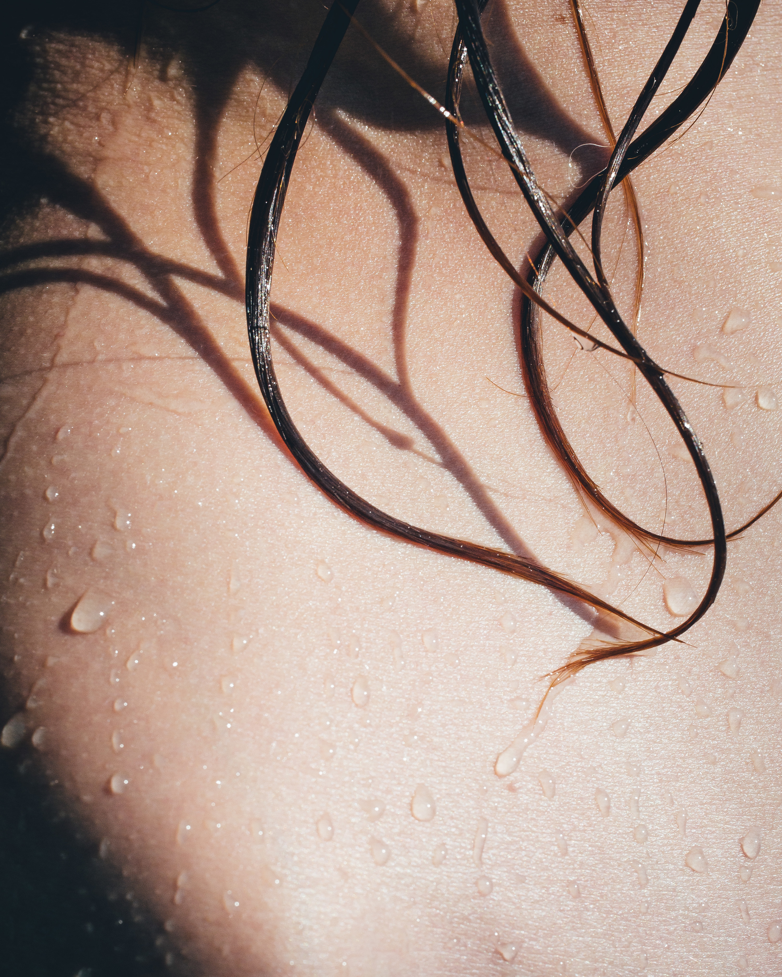 a person&#x27;s wet skin and hair