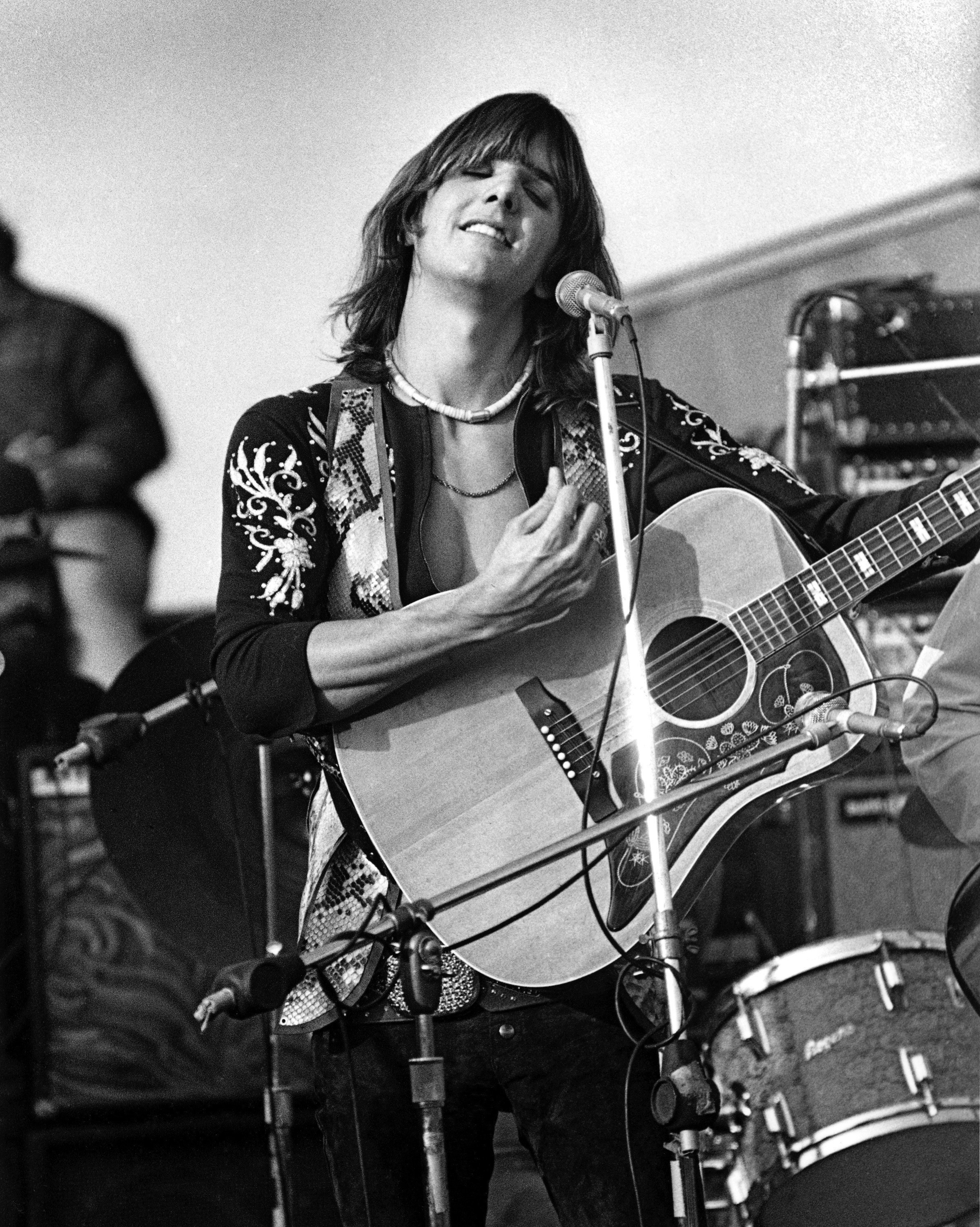 Gram Parsons of The Flying Burrito Brothers performs onstage at The Altamont Speedway on December 6, 1969 in Livermore, California