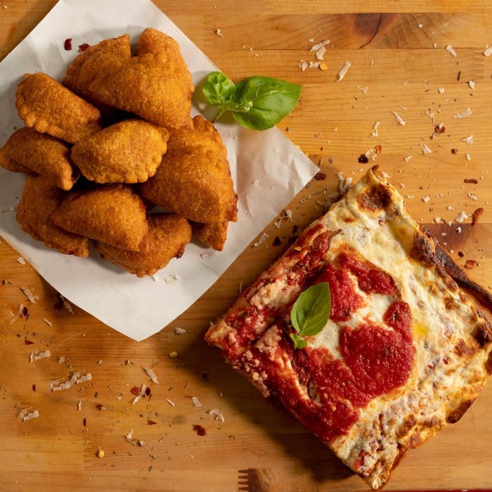 The pizza bites next to a slice of pizza