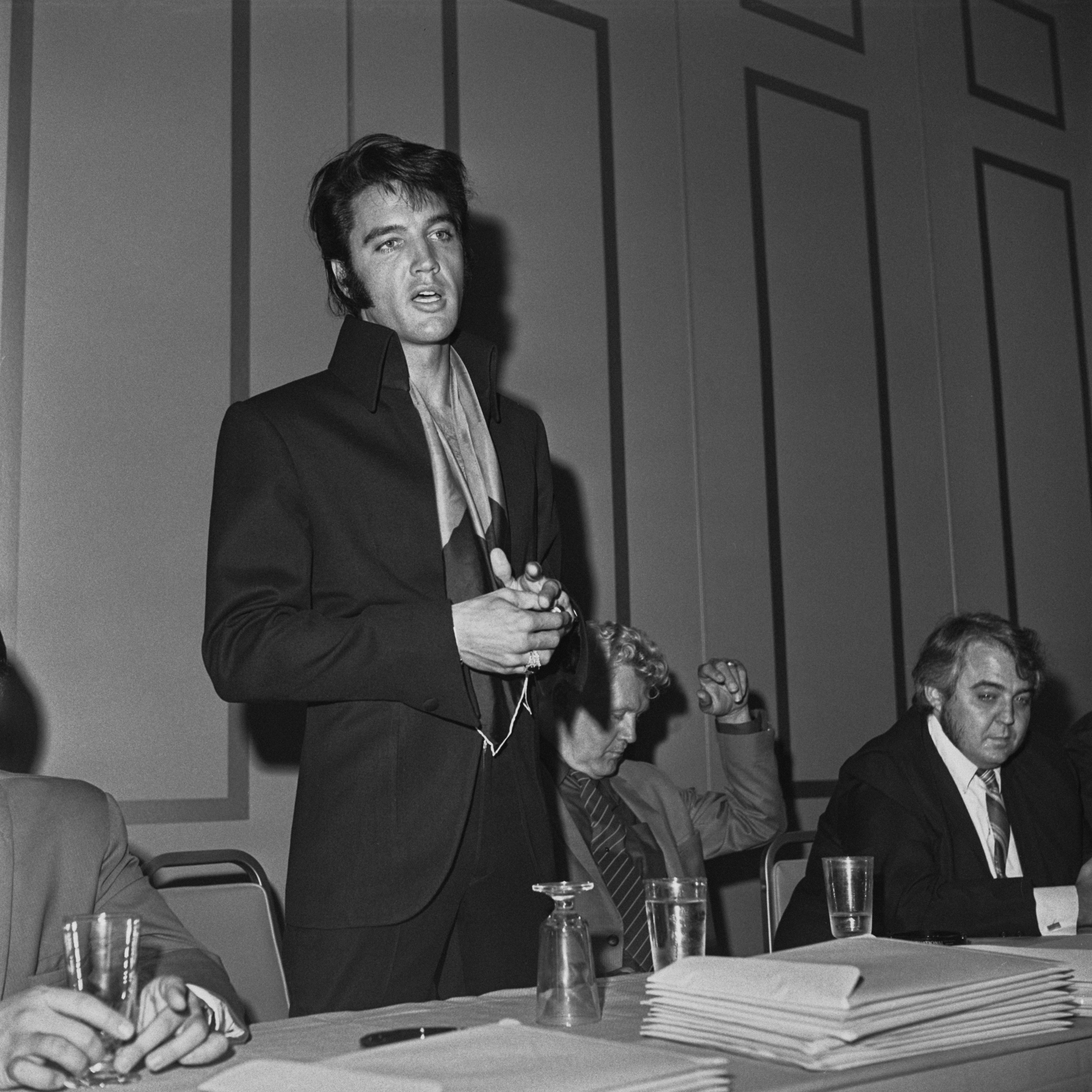 Elvis Presley wearing a jacket with a scarf in the &#x27;convention hall&#x27; of the International Hotel in Las Vegas, Nevada, 1st August 1969