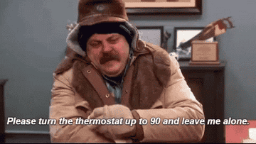 Ron Swanson from Parks &amp;amp; Rec bundled up in a winter coat and hat and gloves saying &quot;please turn the thermostat up to 90 and leave me alone&quot;