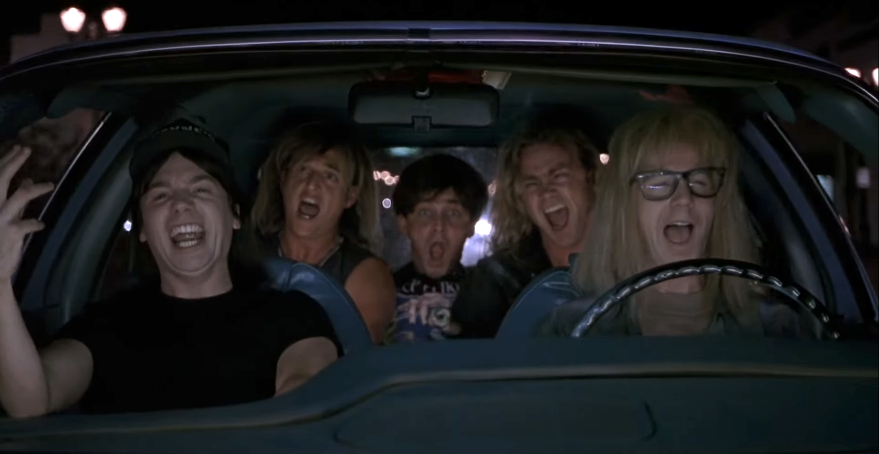 a group of friends singing in the car