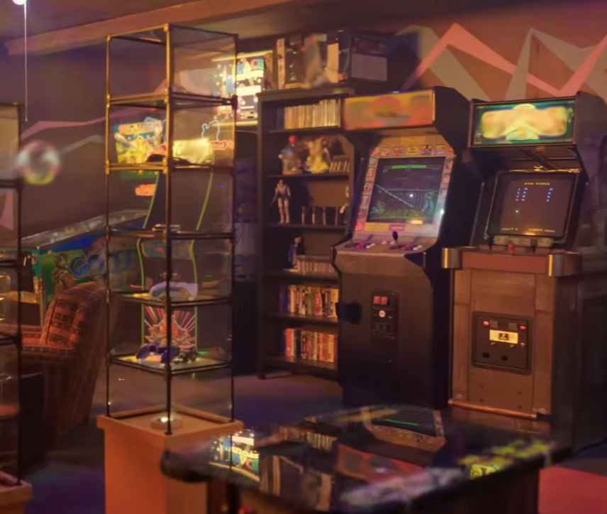 A collection of retro arcade games and cartridges in a tricked out game room from &quot;1UP&quot;