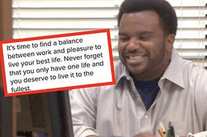 Darryl from "The Office" smiles while looking at his computer