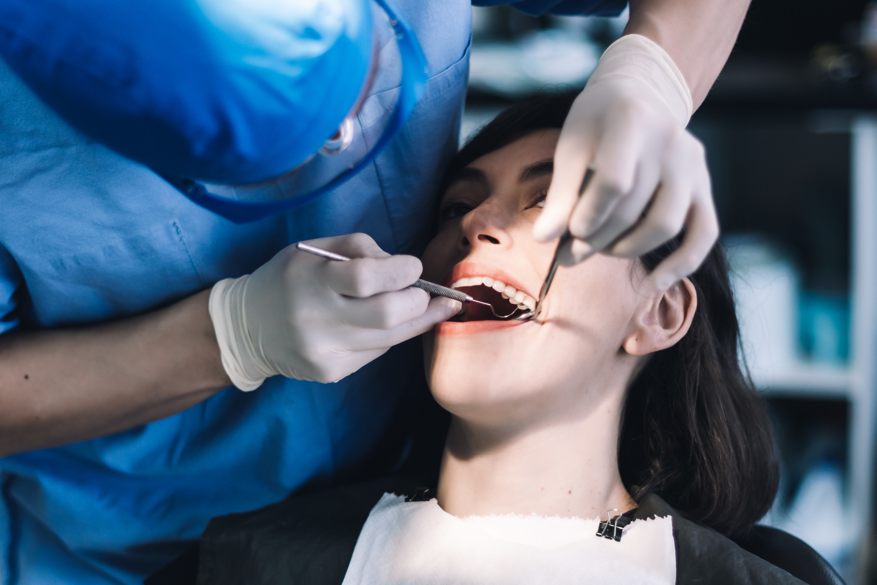 A woman sitting in a dentist&#x27;s chair