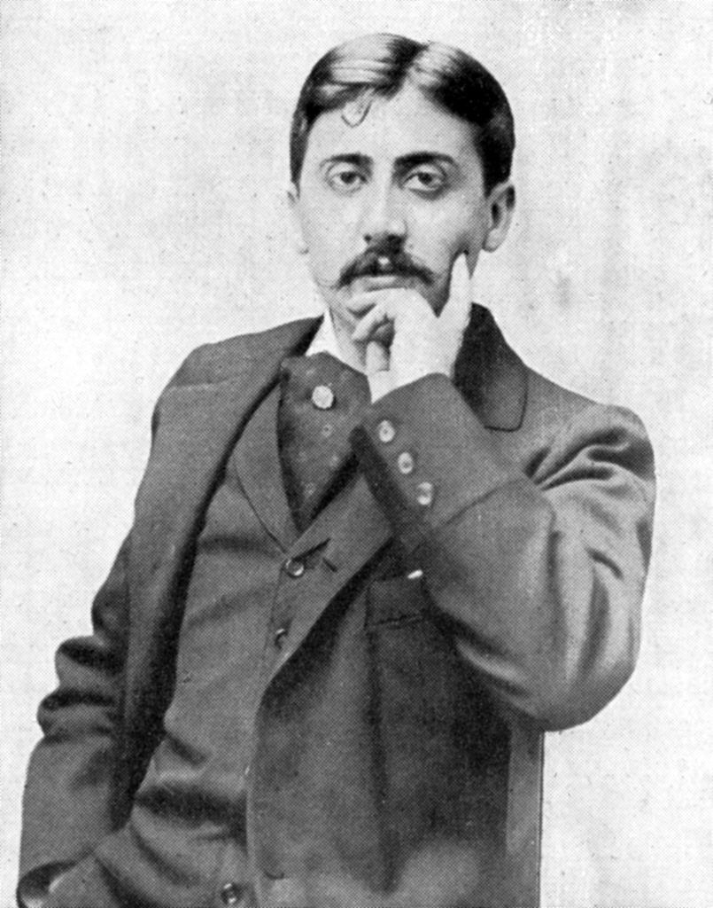 Marcel Proust with his hand to his face in a thinking pose