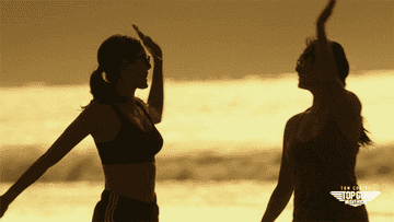 GIF of people high-fiving on the beach