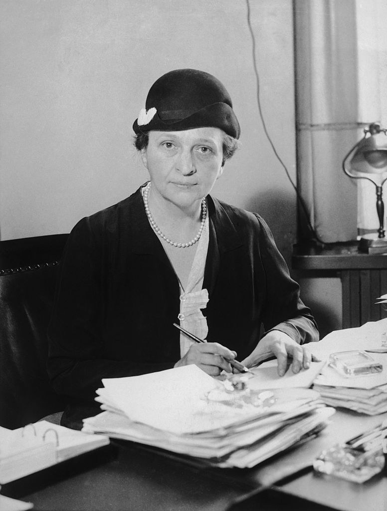 Frances Perkins at a desk