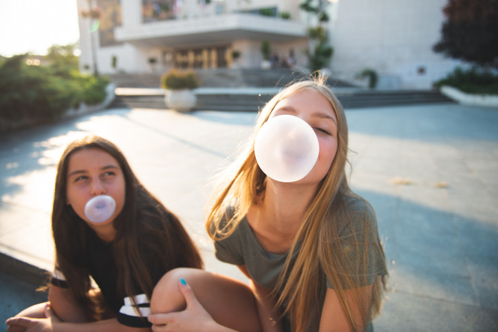 kids blowing bubble gum