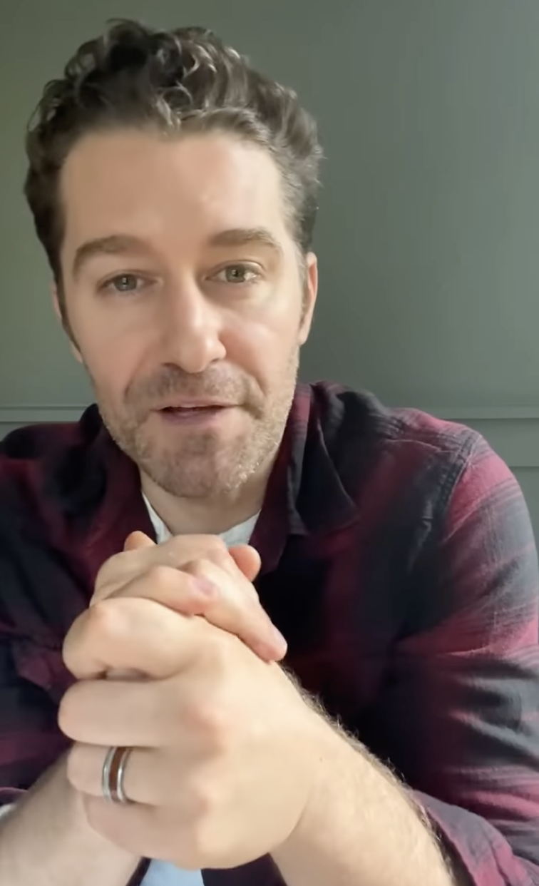 Screenshot of Matthew from the video with his hands clasped
